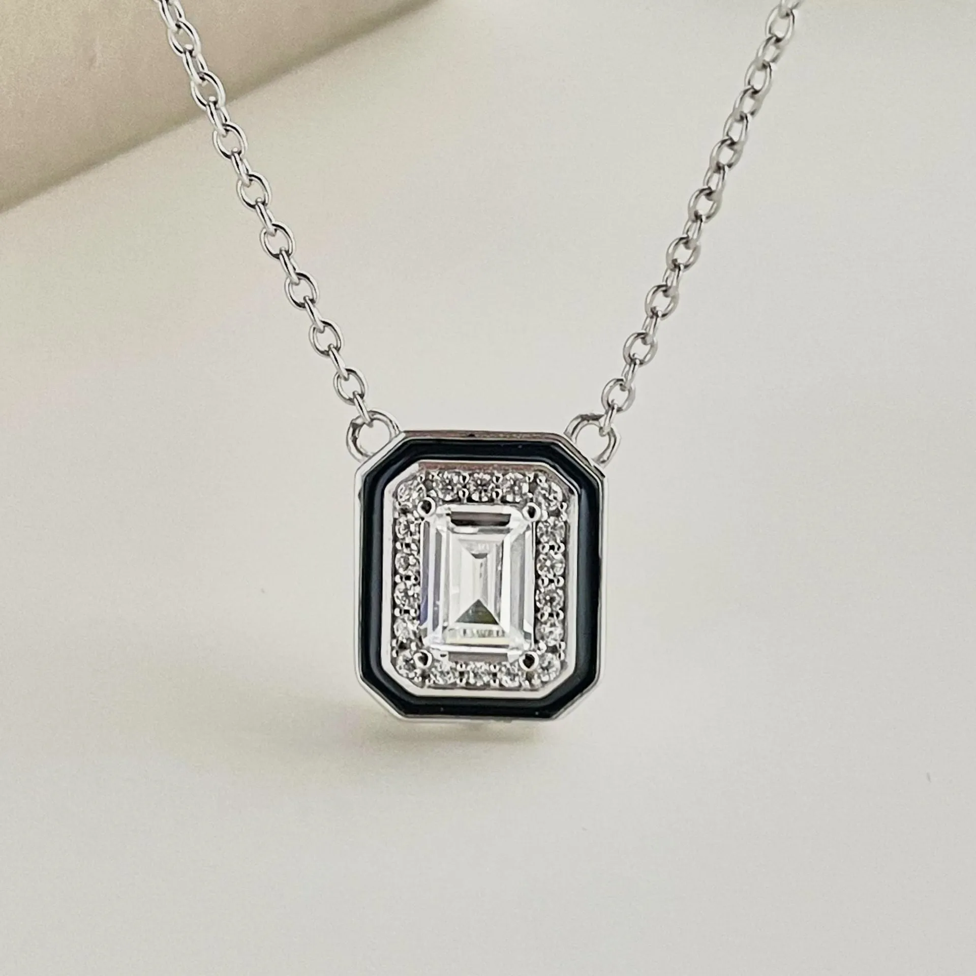 Women's 925 silver rectangular zircon fashion necklace with blue stone pendant on white background