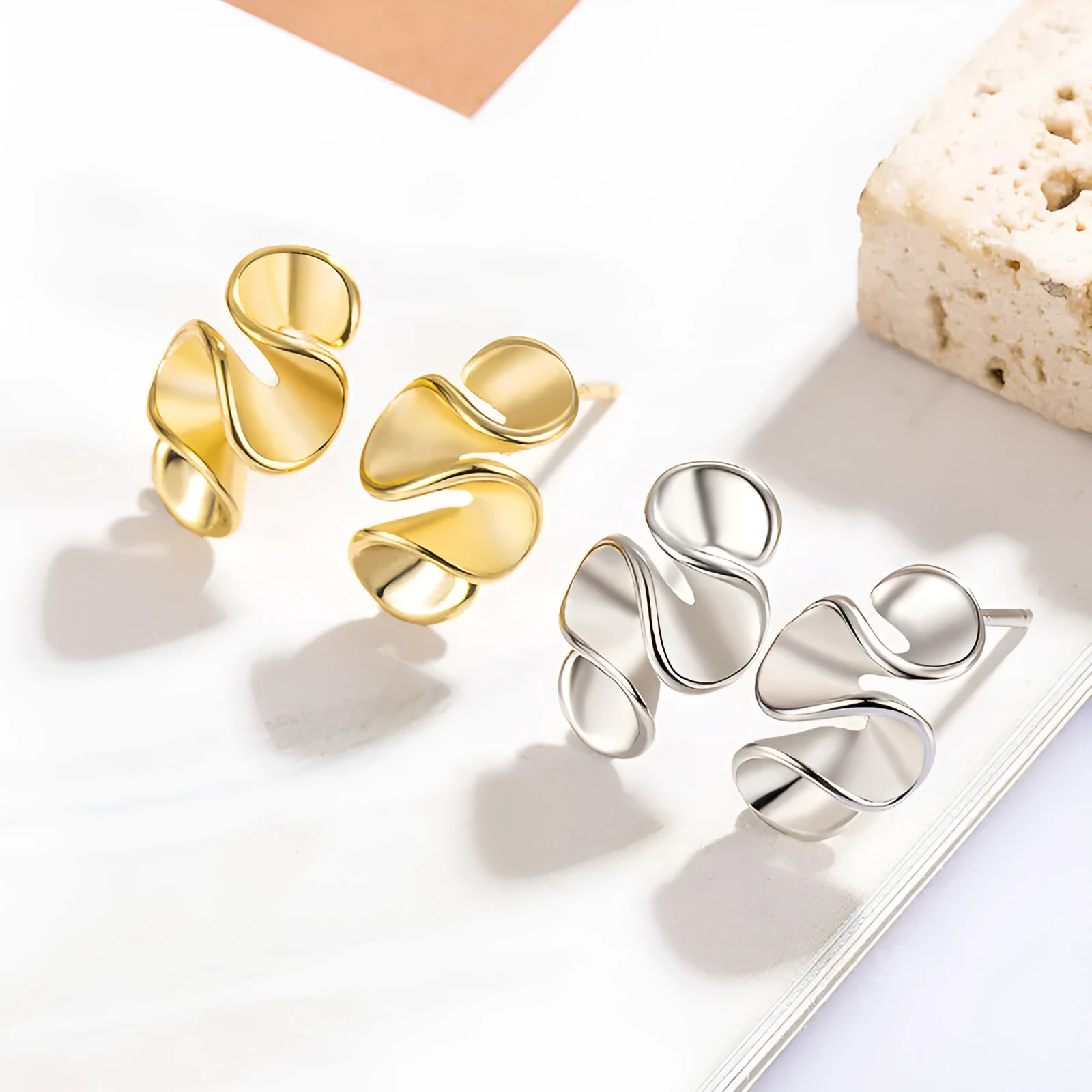 Geometric cream flower stud earrings in gold electroplated finish on copper base with irregular shape