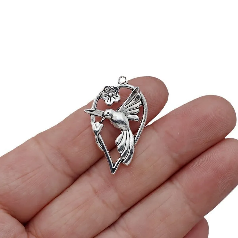 Close-up of a detailed alloy cuckoo bird charm pendant with electroplated finish in colour P234.