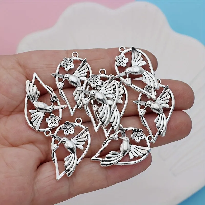 Close-up of a detailed alloy cuckoo bird charm pendant with electroplated finish in colour P234.