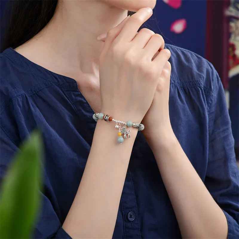 Natural jade vintage bracelet with alloy clasp on a white background.