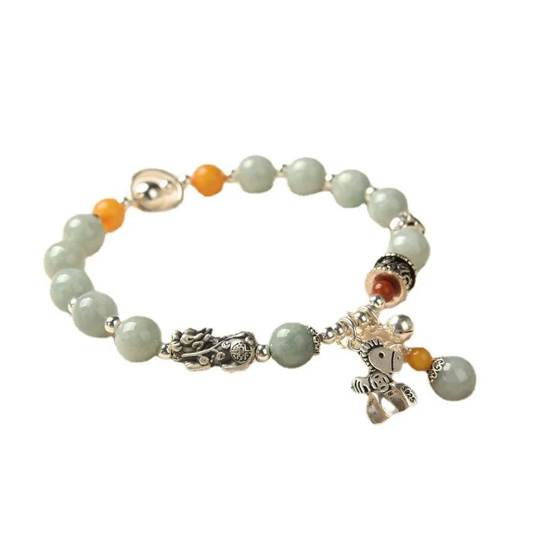 Natural jade vintage bracelet with alloy clasp on a white background.