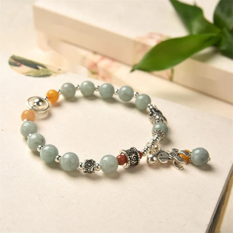 Natural jade vintage bracelet with alloy clasp on a white background.