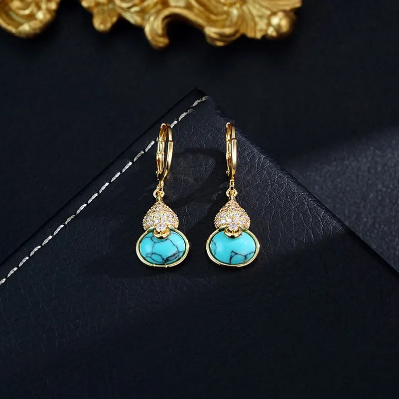 Turquoise gourd flower shape earrings and necklace set on display showing 18K gold plated brass finish