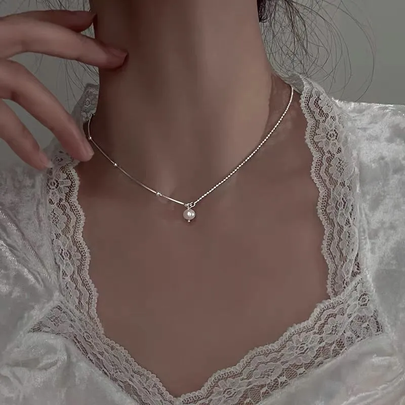 Titanium steel necklace with flower-shaped pearl pendant and adjustable chain