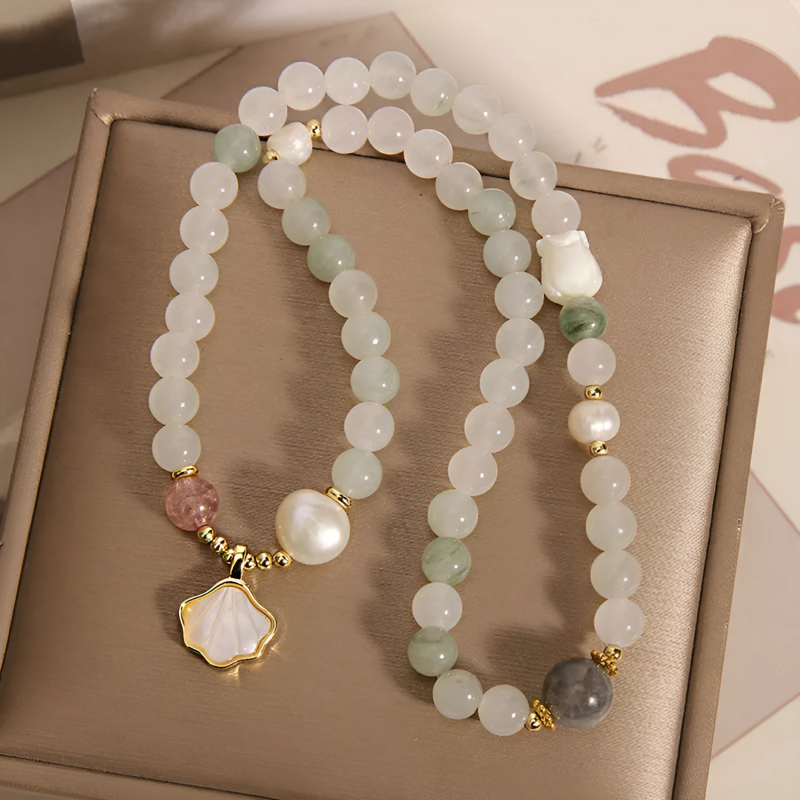 Crystal bracelet with Tianshan jade shell ginkgo leaf pendant and gold-plated gemstone settings