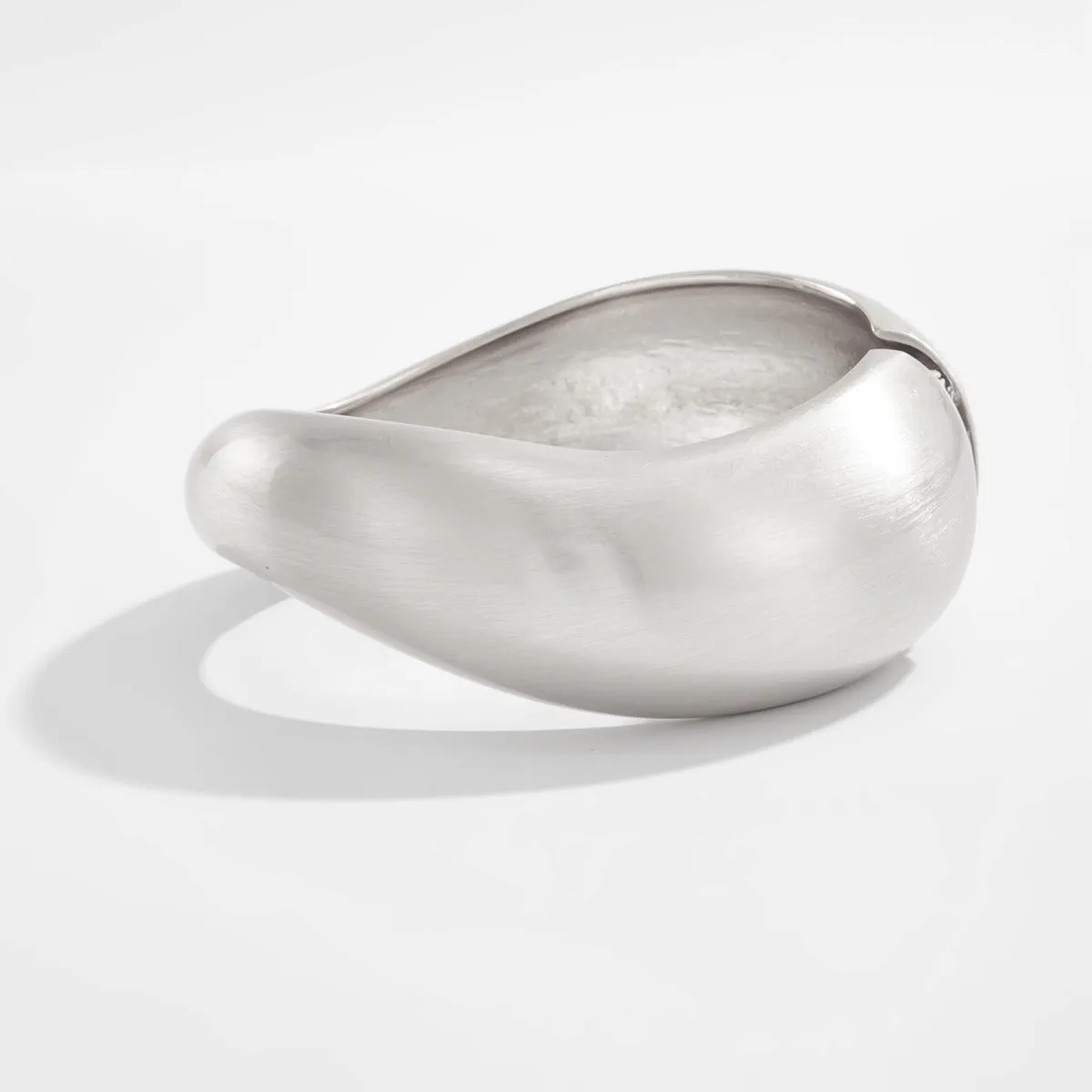Metal alloy opening bracelet in matte or glossy finish with ellipse design element cold wind style