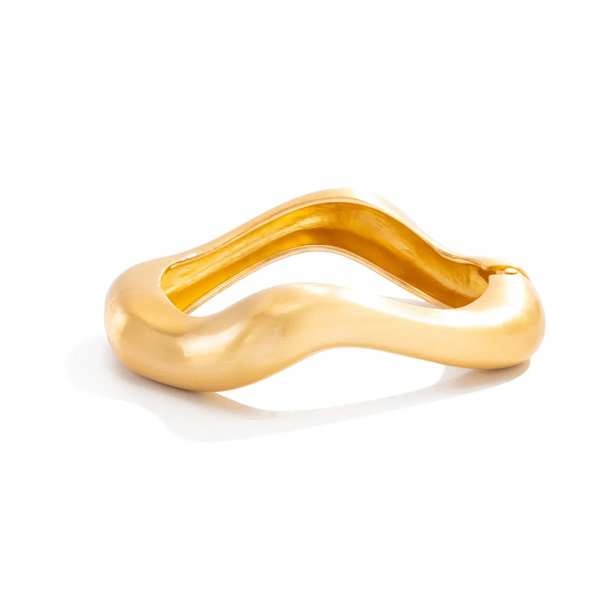 Metal alloy opening bracelet in matte or glossy finish with ellipse design element cold wind style