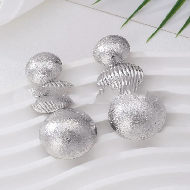 Retro women's polka dot metal bead drop earrings in frosted gold finish on a neutral background