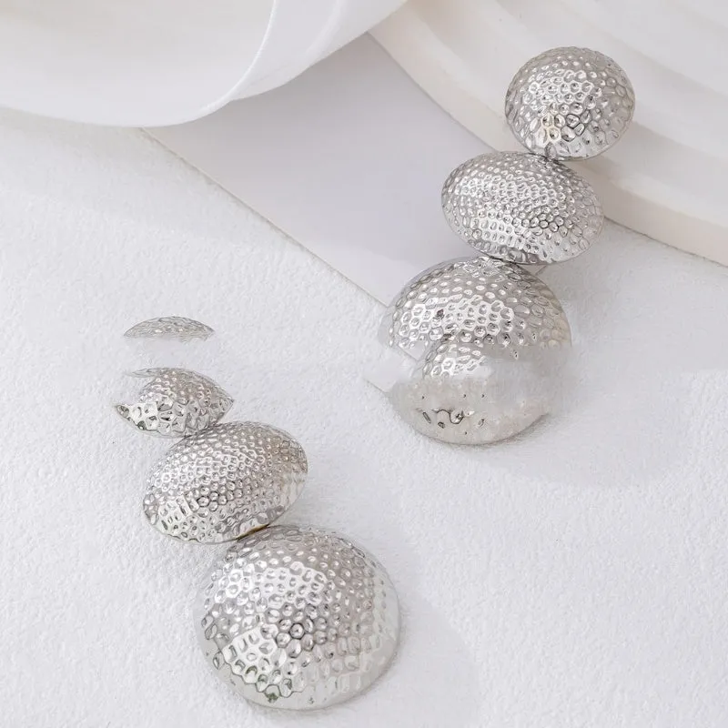 Retro women's polka dot metal bead drop earrings in frosted gold finish on a neutral background