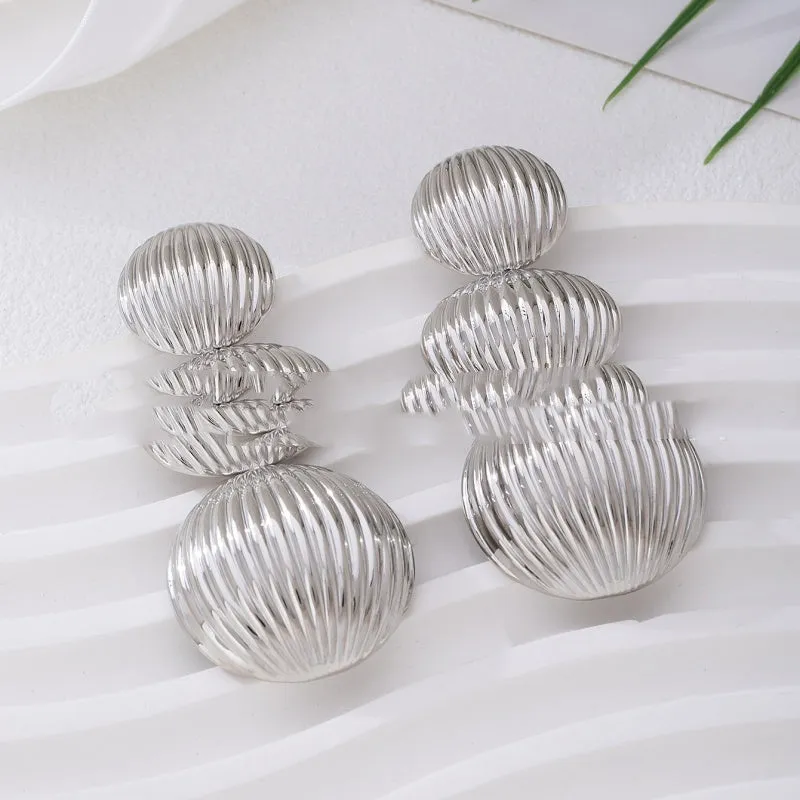 Retro women's polka dot metal bead drop earrings in frosted gold finish on a neutral background
