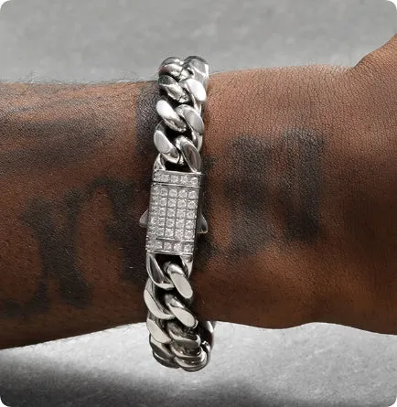8mm gold titanium steel Cuban bracelet on display with alloy gemstone inlay