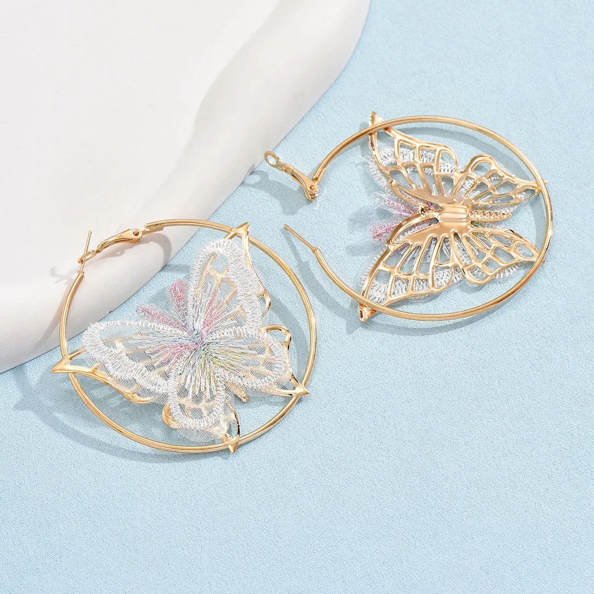 Gold butterfly clip-on earrings for women with geometric design and iron construction