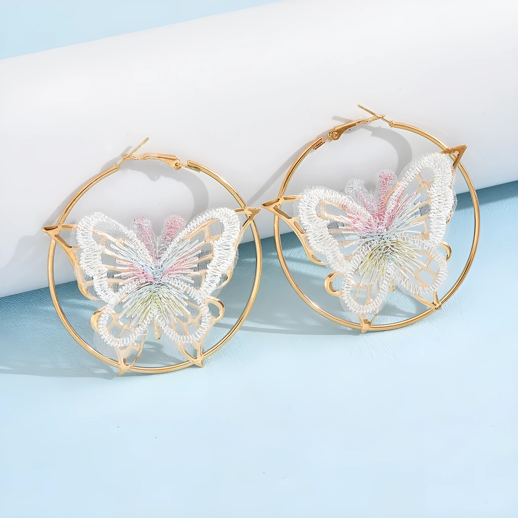Gold butterfly clip-on earrings for women with geometric design and iron construction
