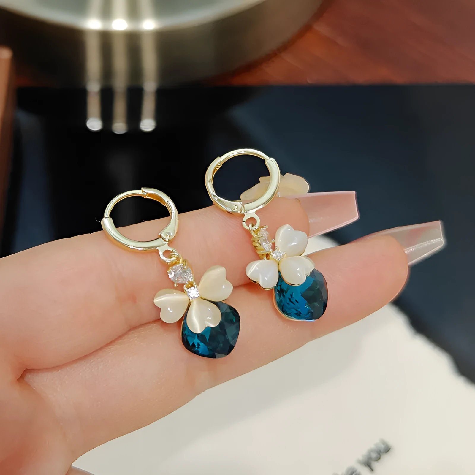 Electroplated blue crystal earrings with bow shape on alloy base