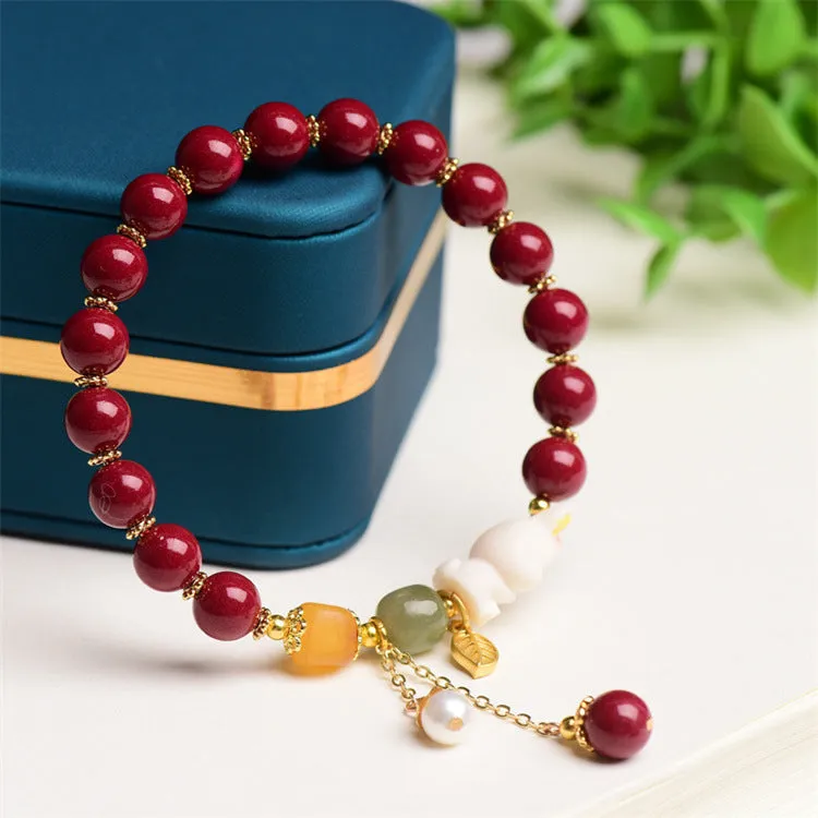 Tian Yu natural cinnabar bracelet with rabbit design in 8mm or 10mm sizes