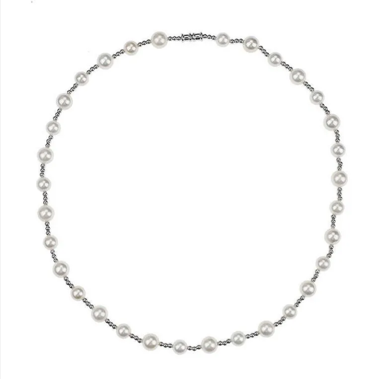 White freshwater pearl necklace with round bead chain and sterling silver platinum beads on a neutral background