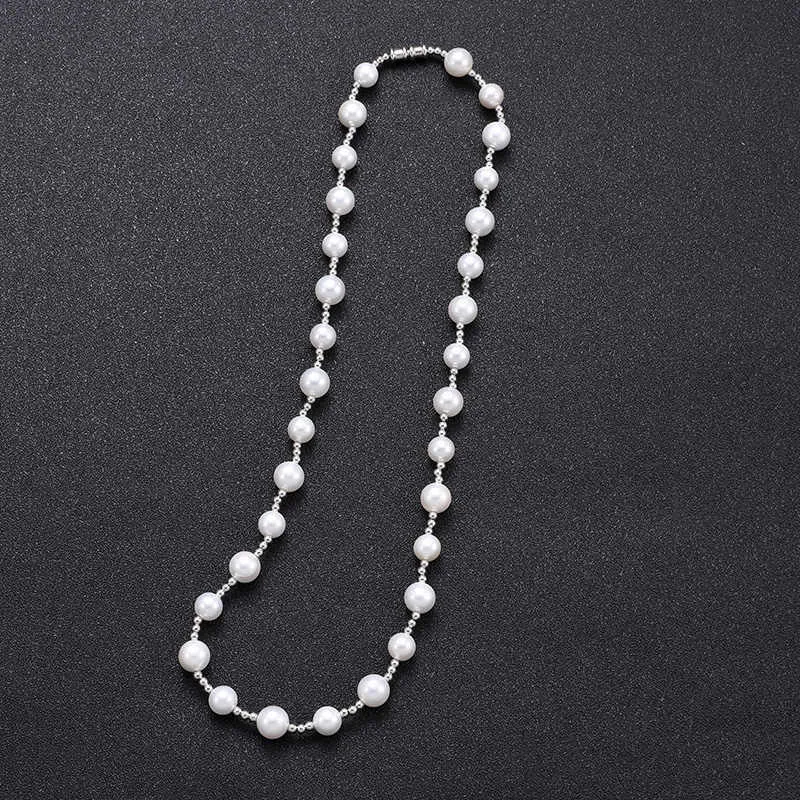 White freshwater pearl necklace with round bead chain and sterling silver platinum beads on a neutral background