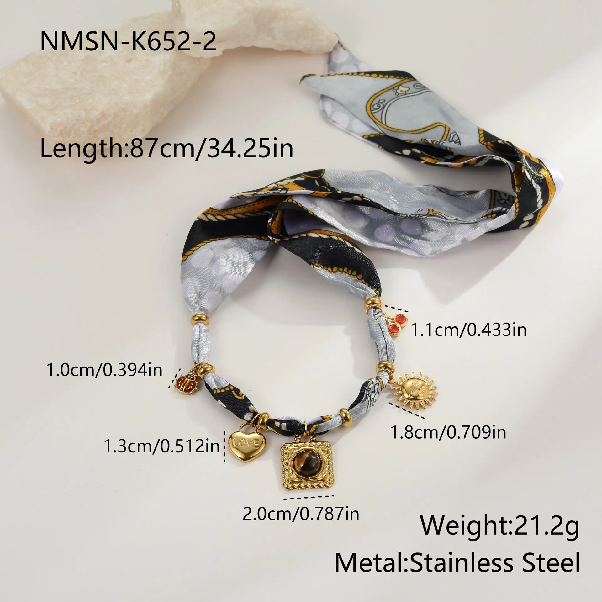 Gold tone 18K electroplated stainless steel necklace with regular chain on white background