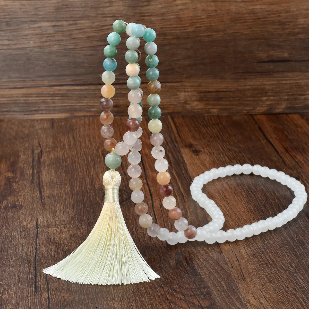 Long beaded bohemian necklace with 108 gemstone tassel pendants on a ball chain.