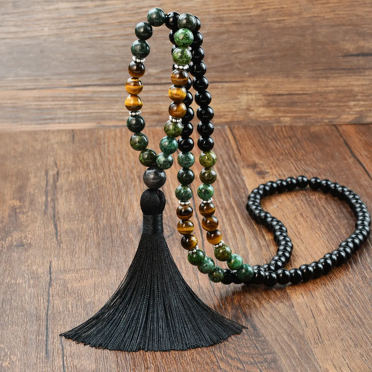 Long beaded bohemian necklace with 108 gemstone tassel pendants on a ball chain.
