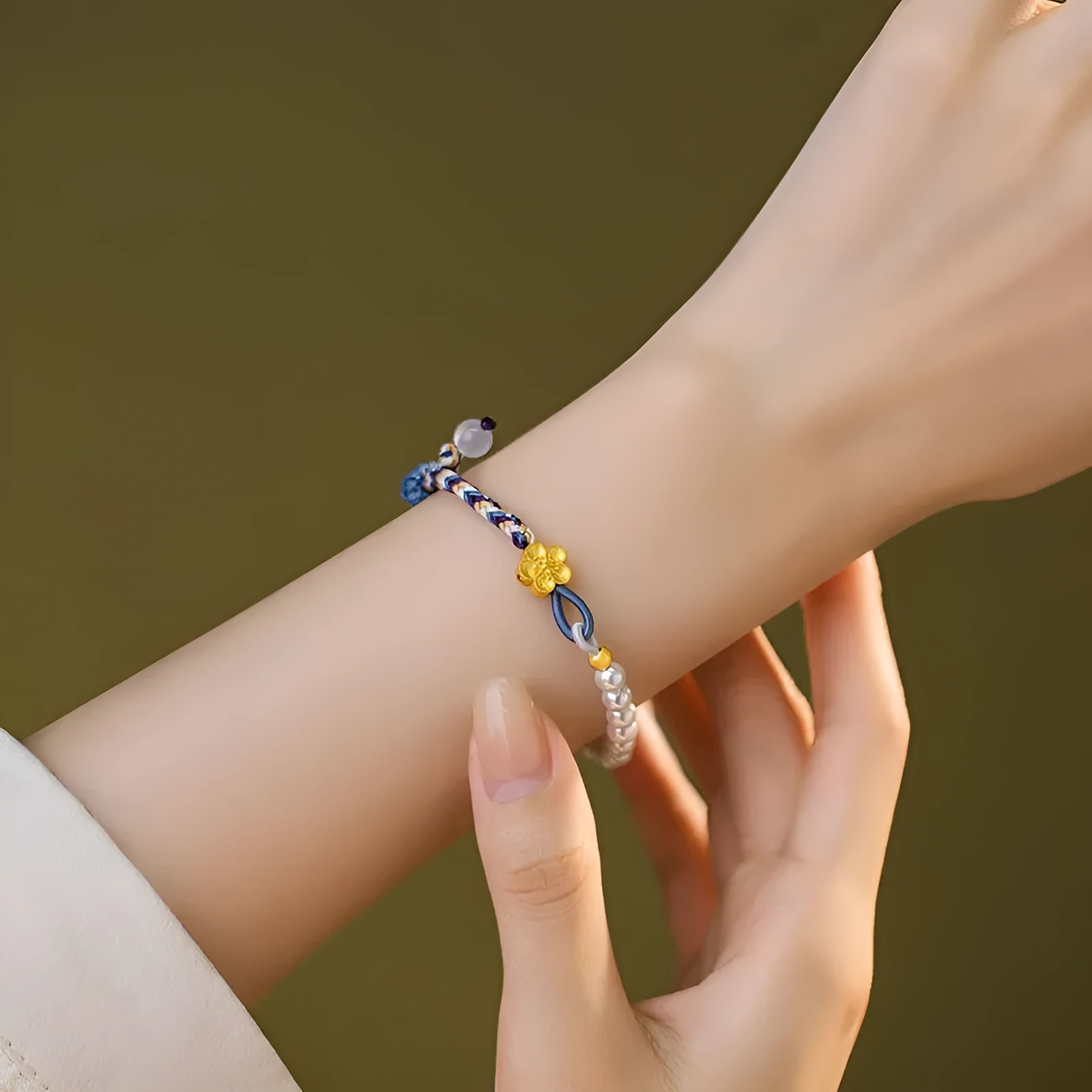 Peach coloured adjustable cord bracelet with Chinese flower weaving and sterling silver chalcedony accents