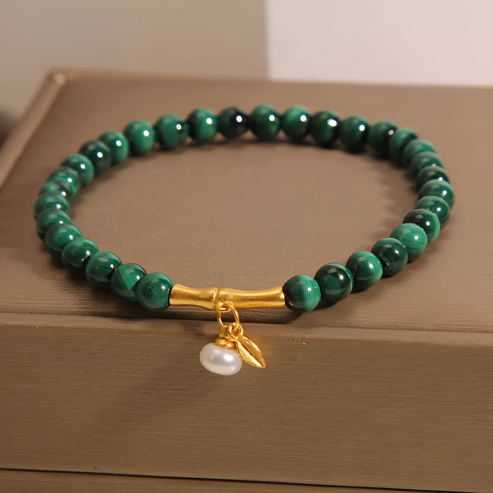 Women's white crystal lucky bamboo bracelet with adjustable clasp on a wrist.
