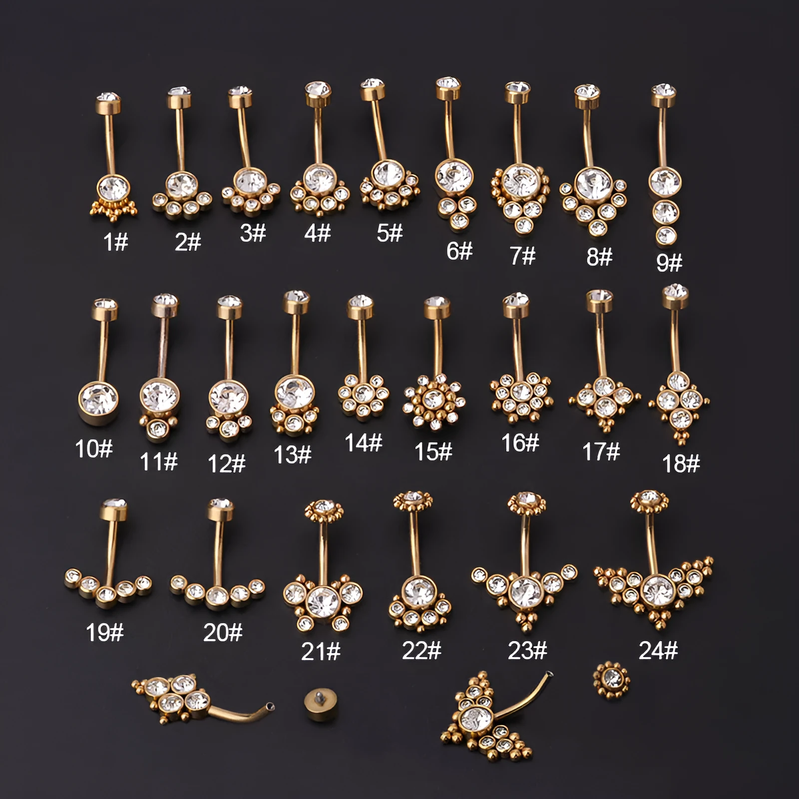 Gold stainless steel belly button ring with clear artificial gemstone inlay on white background
