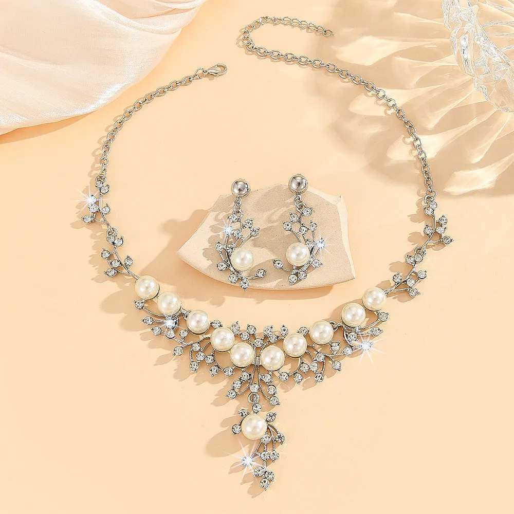 Women's fashion necklace and earrings set in gold or white with alloy construction and floral pattern