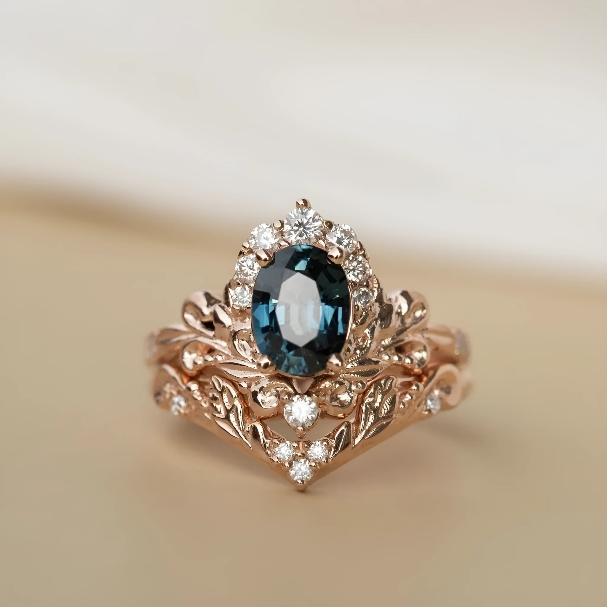 Women's rose gold branch flower ring with inlaid blue crystal, alloy construction, side view on finger