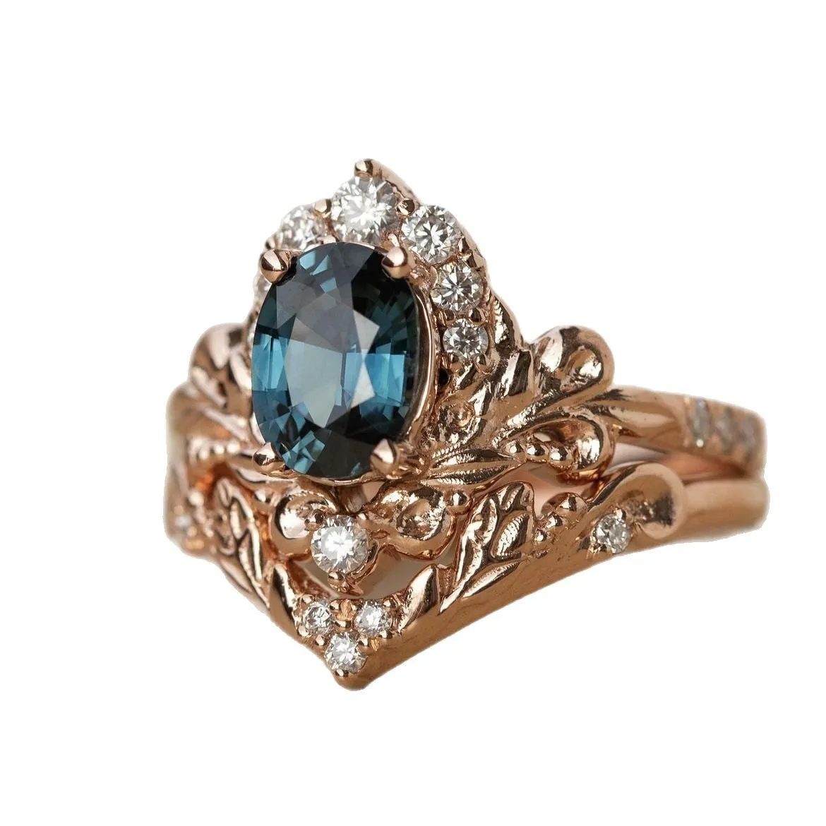 Women's rose gold branch flower ring with inlaid blue crystal, alloy construction, side view on finger