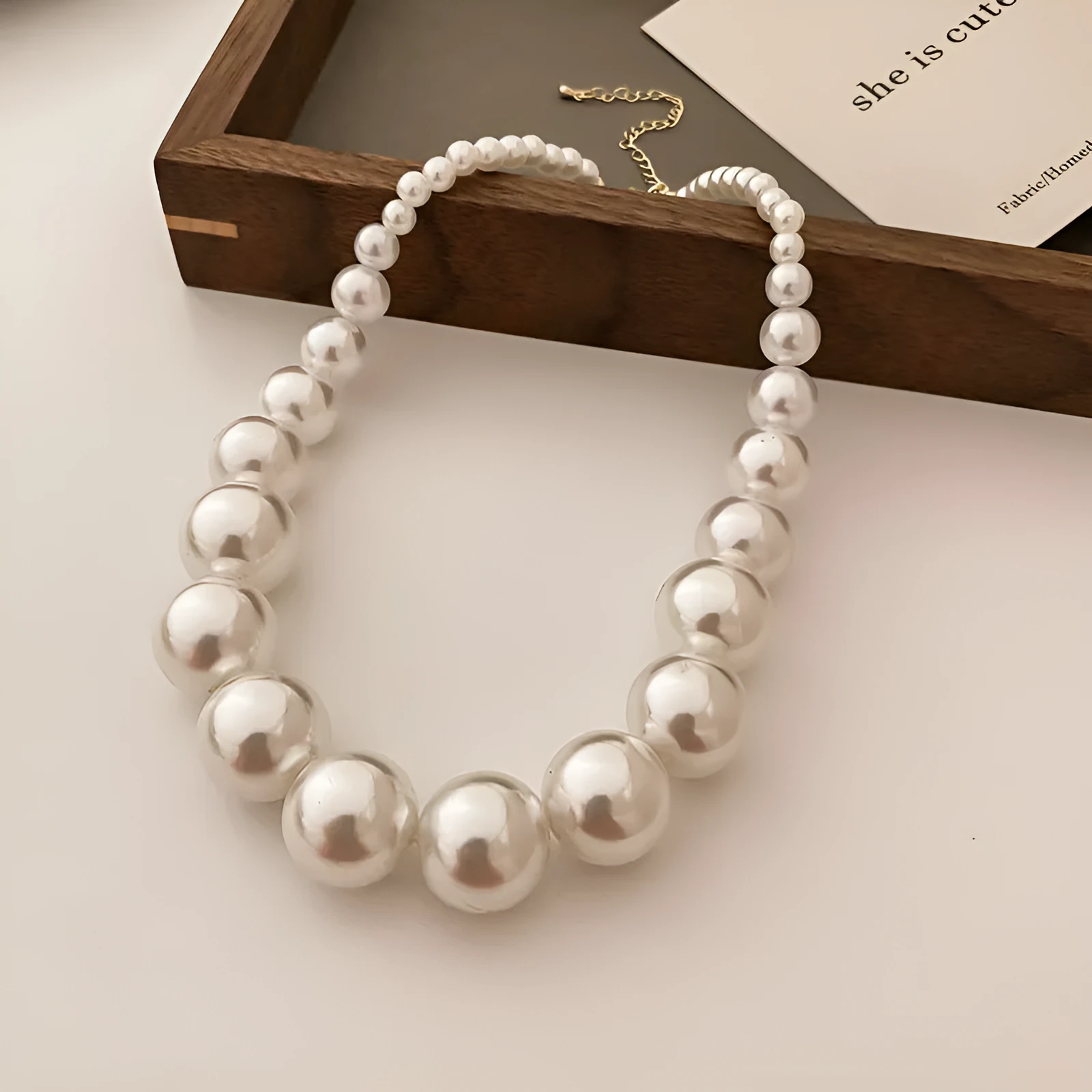 French retro gradient white imitation pearl necklace with U-shaped drape and ball bead chain for women
