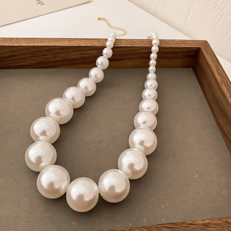 French retro gradient white imitation pearl necklace with U-shaped drape and ball bead chain for women