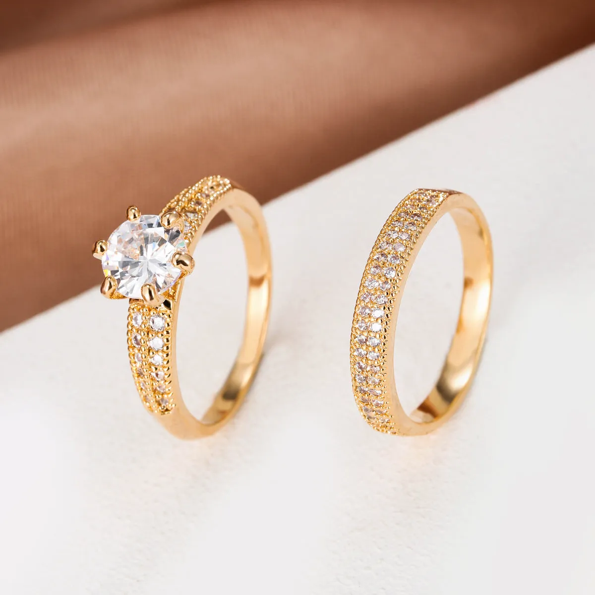Copper zircon hollow ring with geometric design in golden-white zirconium finish