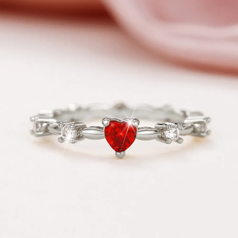 Gold and silver electroplated peach heart ring with zircon stones on a copper base.