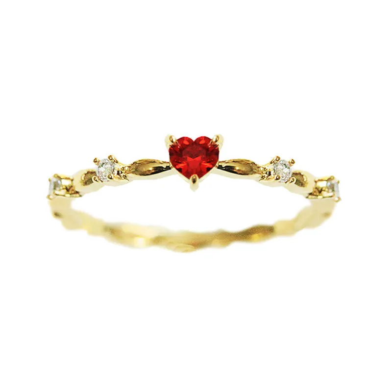 Gold and silver electroplated peach heart ring with zircon stones on a copper base.