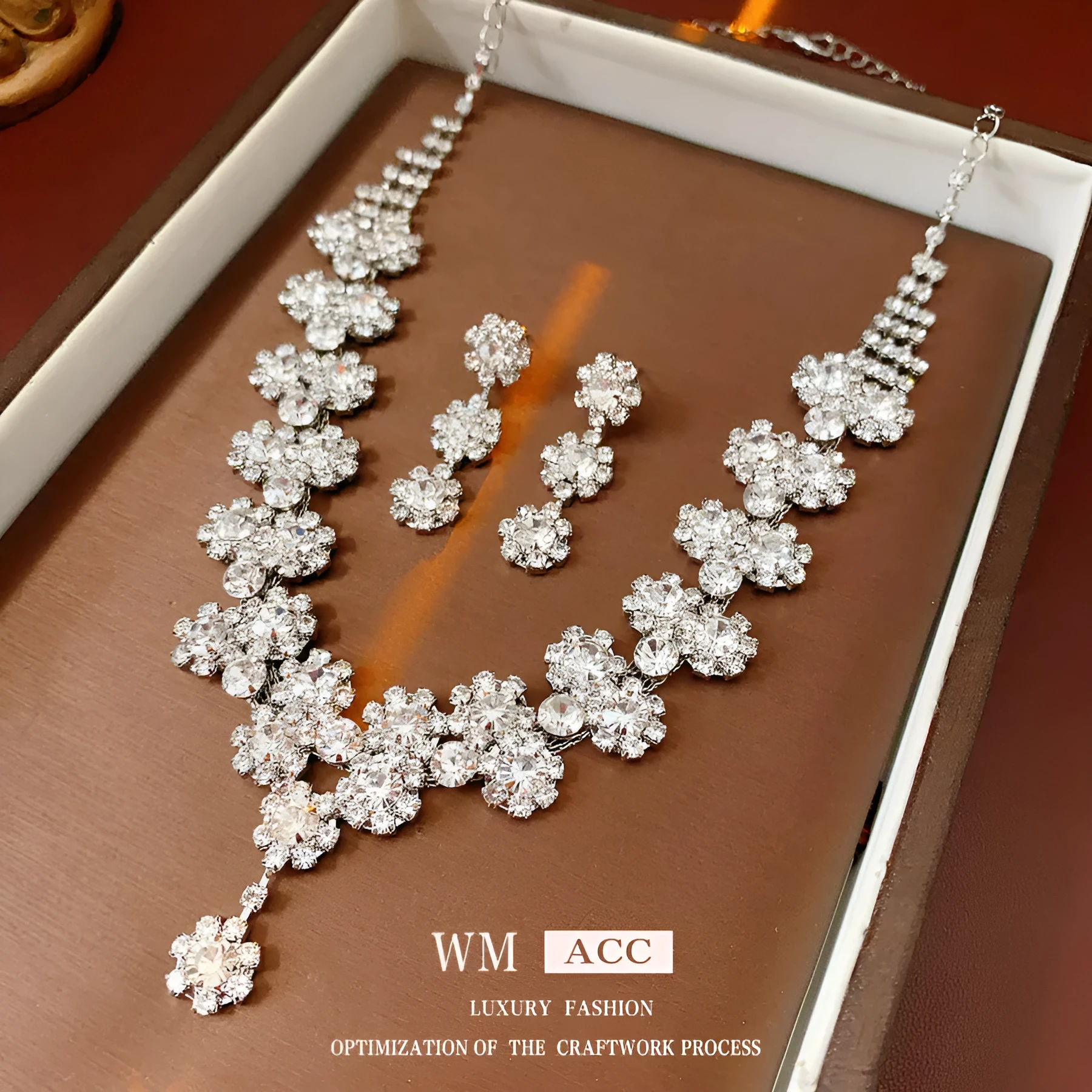 Diamond sunflower earrings and necklace set in silver finish on display