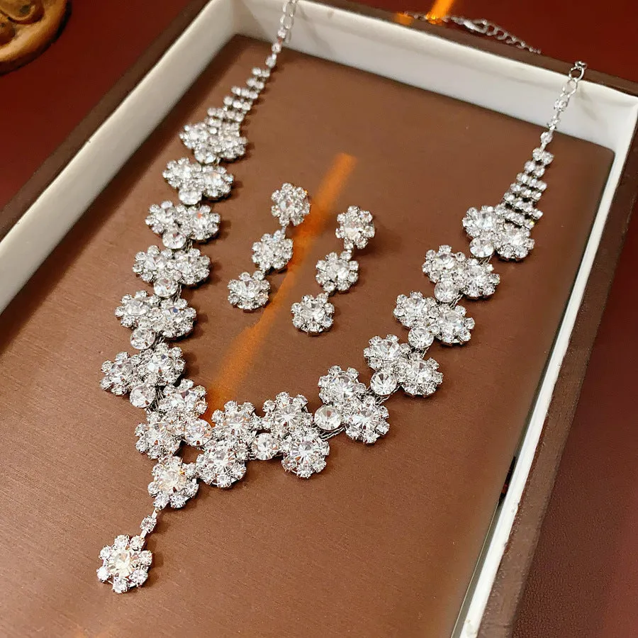 Diamond sunflower earrings and necklace set in silver finish on display