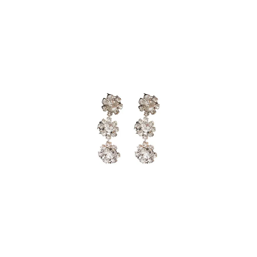 Diamond sunflower earrings and necklace set in silver finish on display