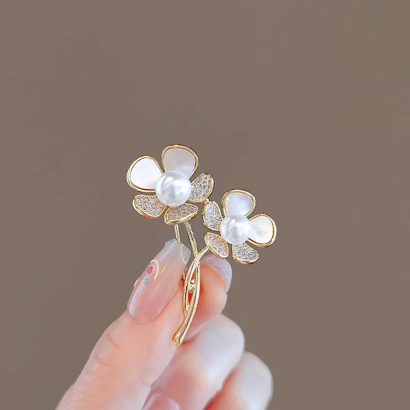 Alloy brooch in natural flower shape with electroplated finish, featuring adjustable and anti-exposure pin closure for women's coats and suits.