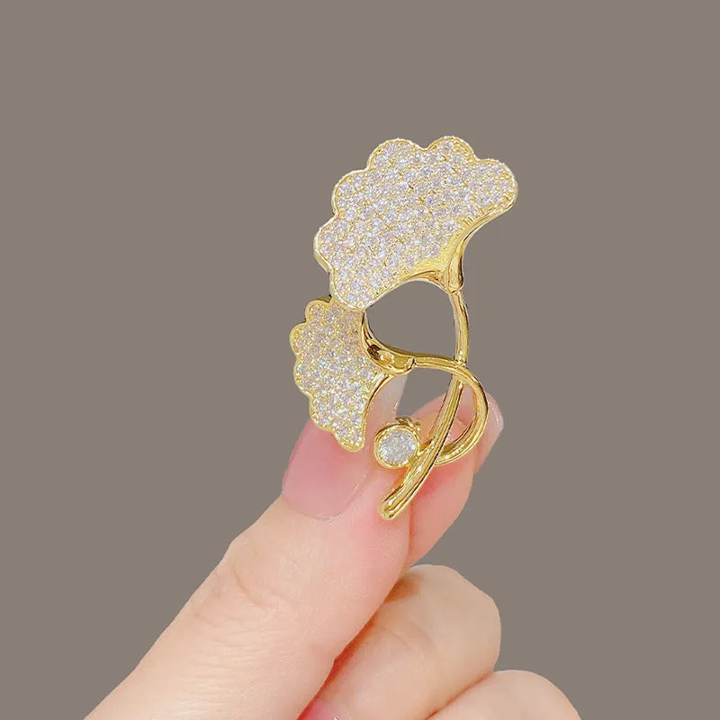 Alloy brooch in natural flower shape with electroplated finish, featuring adjustable and anti-exposure pin closure for women's coats and suits.