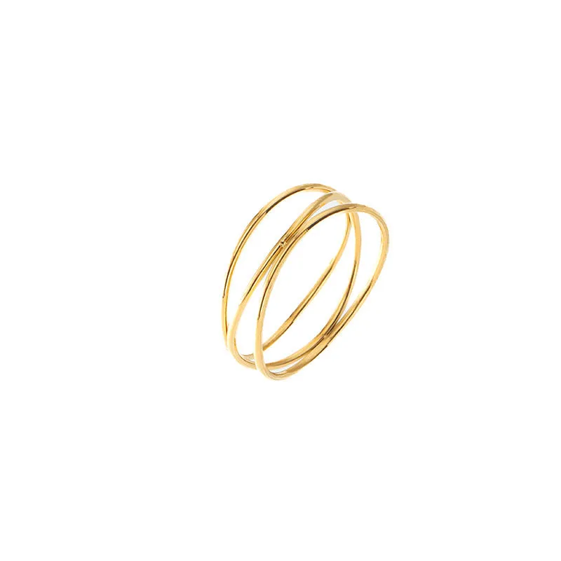 Gold geometric coil ring on a plain background, showing its three-layer titanium steel construction