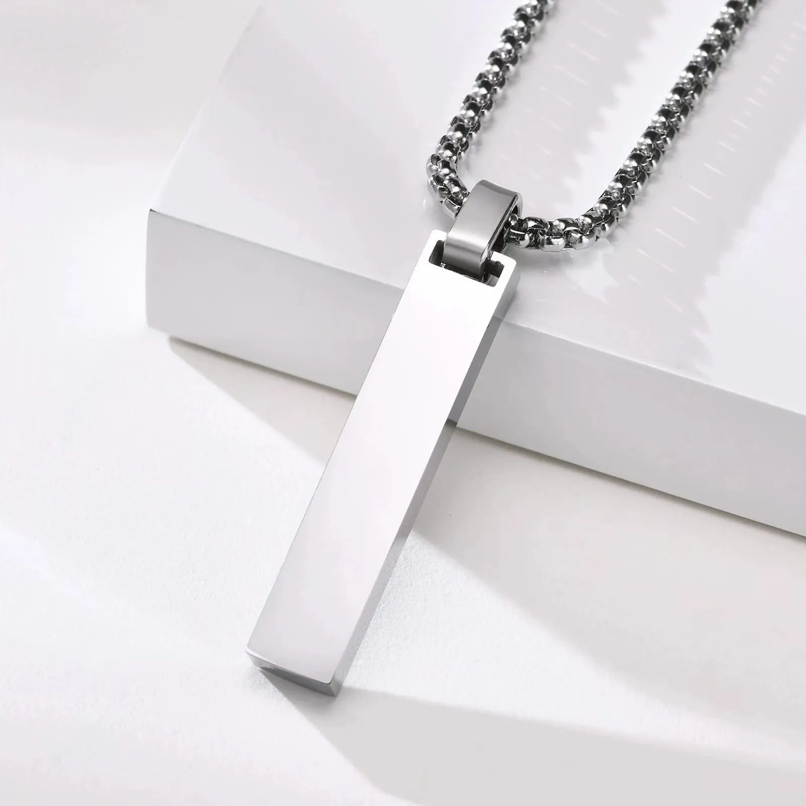 Stainless steel roman numeral pendant necklace available in black, gold, and steel colour options