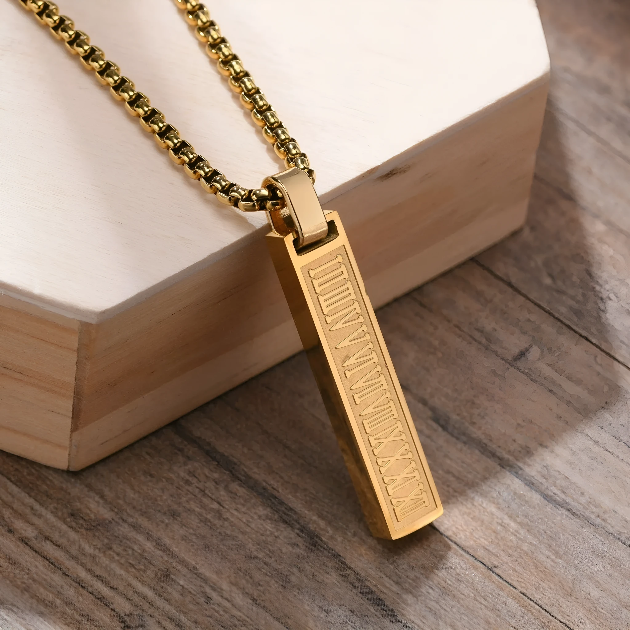 Stainless steel roman numeral pendant necklace available in black, gold, and steel colour options
