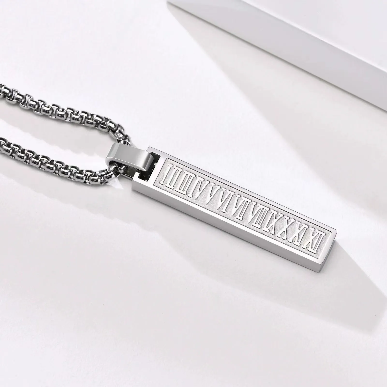 Stainless steel roman numeral pendant necklace available in black, gold, and steel colour options