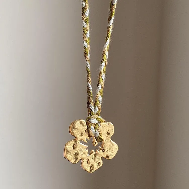 Gold hibiscus rosa-sinensis resin pendant necklace with artificial crystal bow on alloy chain for ladies