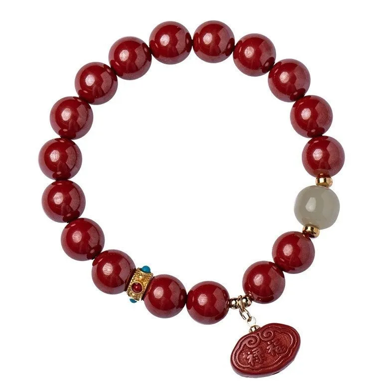 Red cinnabar Emperor Sandstone Ping An Fu Lu adjustable bracelet on wrist.