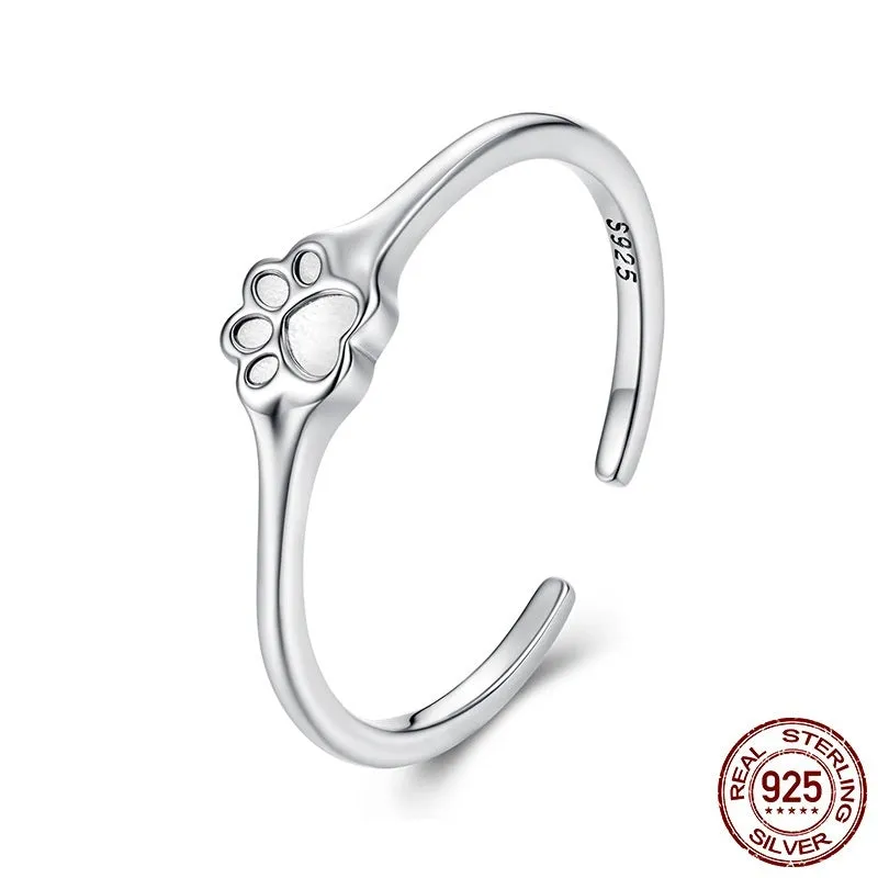 S925 sterling silver polished paw print open ring on woman's finger, adjustable size
