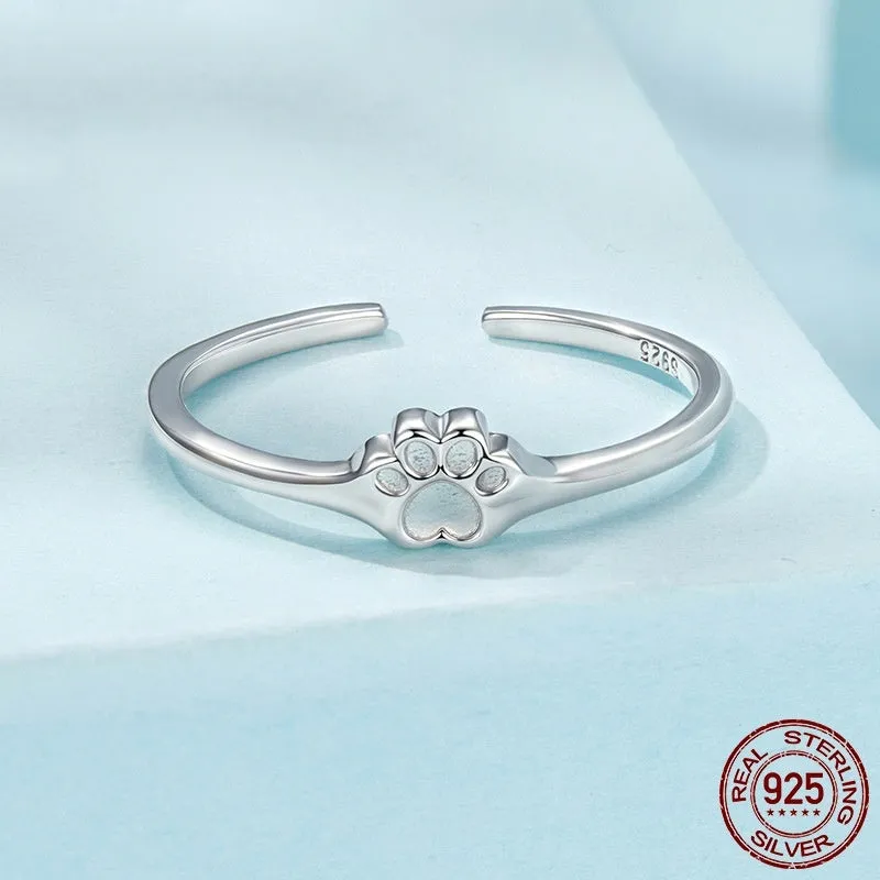 S925 sterling silver polished paw print open ring on woman's finger, adjustable size