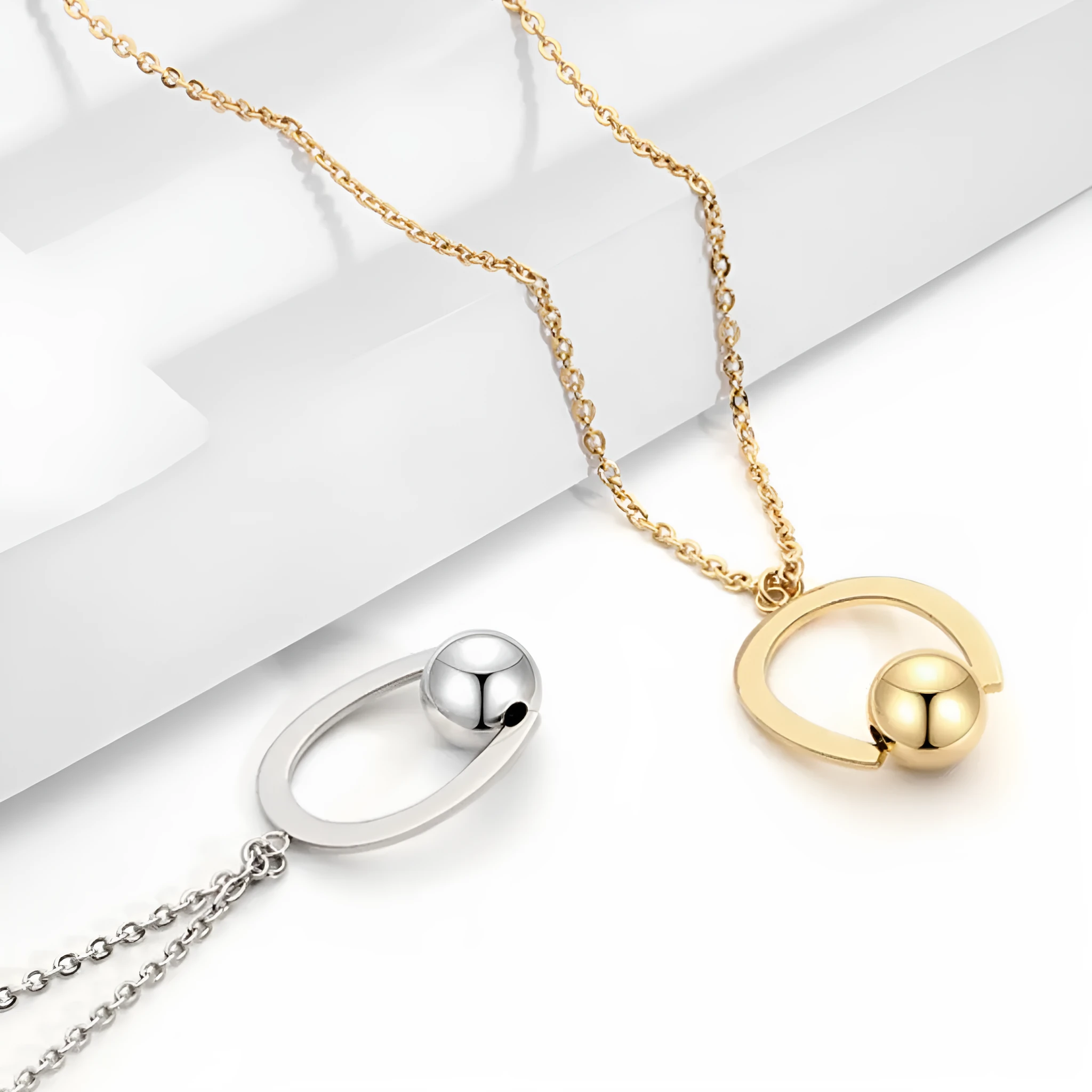 Adjustable stainless steel necklace with cross chain design and geometric pendant in gold colour.